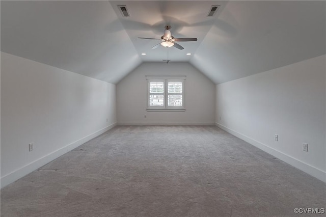 bonus room featuring ceiling fan, light colored carpet, and lofted ceiling