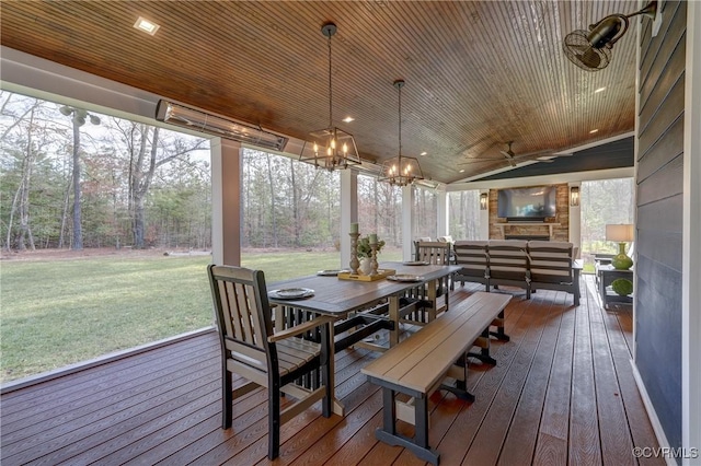 exterior space featuring an inviting chandelier and wooden ceiling