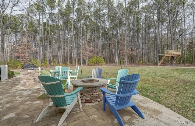 view of patio / terrace with an outdoor fire pit