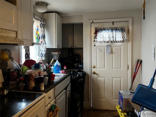 kitchen featuring range with electric stovetop and sink