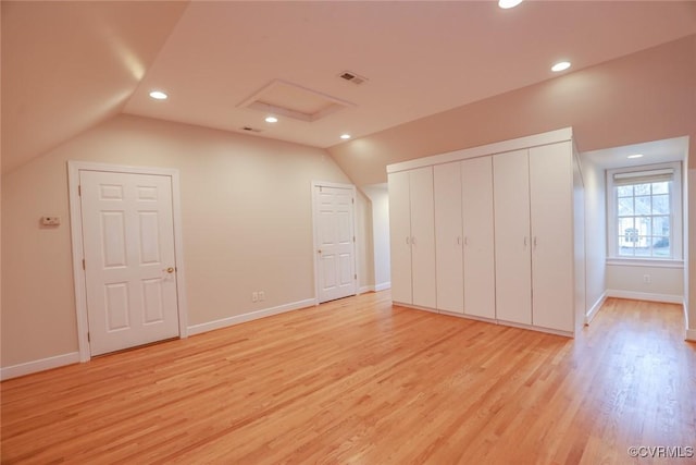 bonus room featuring vaulted ceiling and light hardwood / wood-style flooring