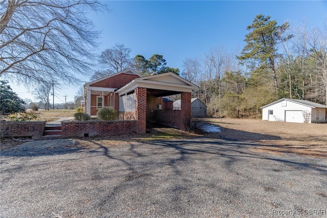 view of front facade featuring a garage, an outdoor structure, and covered porch