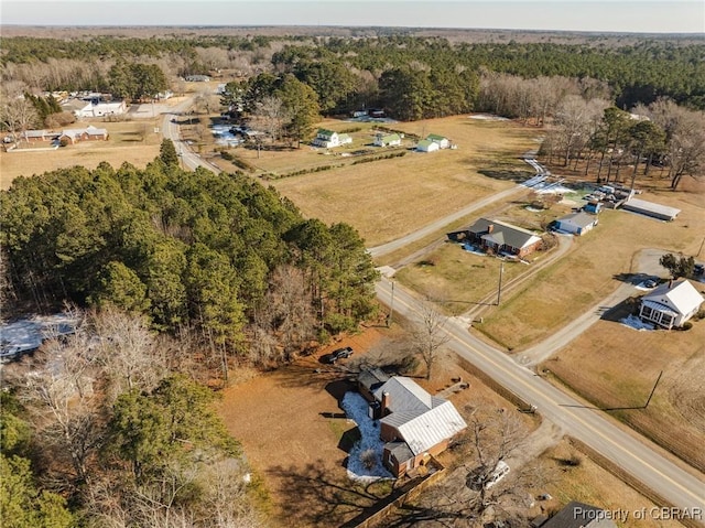 birds eye view of property featuring a rural view