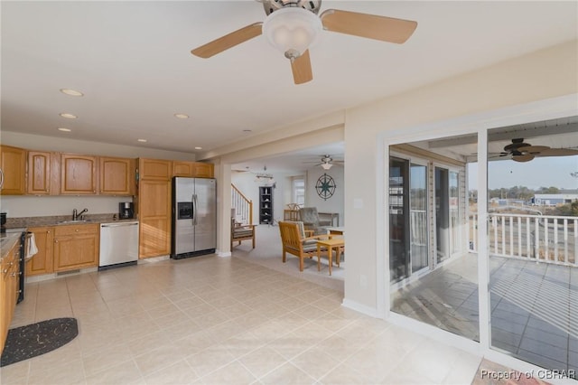 kitchen with ceiling fan, appliances with stainless steel finishes, and sink