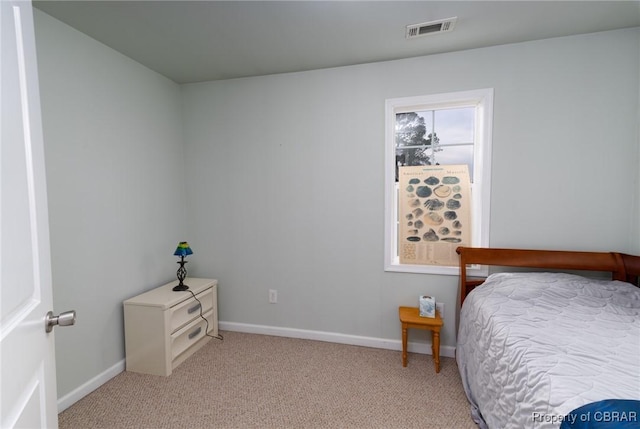 bedroom with light carpet