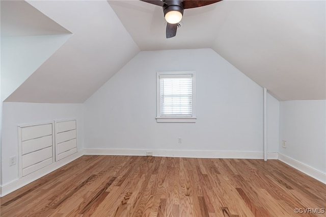 additional living space with vaulted ceiling, ceiling fan, and light hardwood / wood-style floors