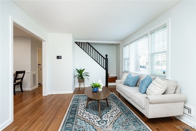 living room featuring dark wood-type flooring