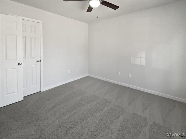 empty room with carpet and ceiling fan