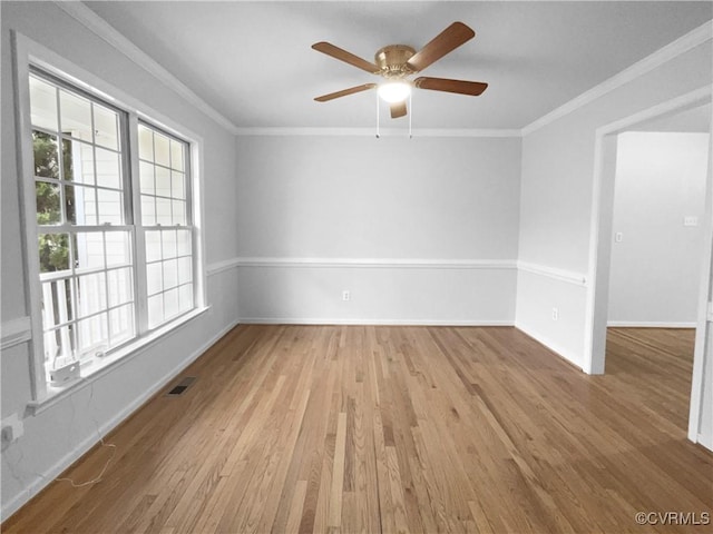 unfurnished room with ceiling fan, ornamental molding, and light hardwood / wood-style flooring