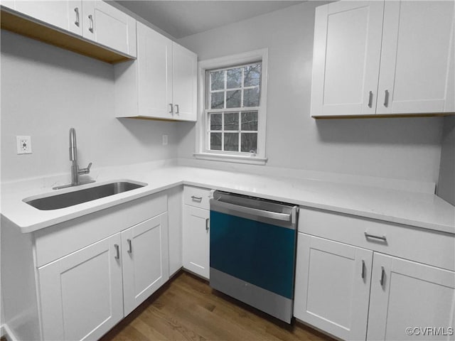 kitchen with white cabinetry, dishwasher, sink, and dark hardwood / wood-style flooring