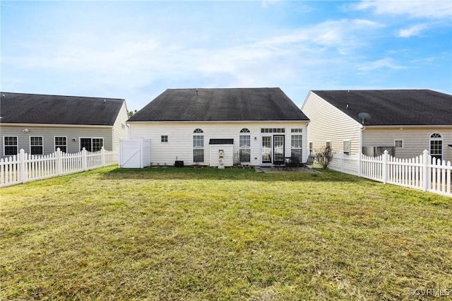 back of property with a patio area and a lawn