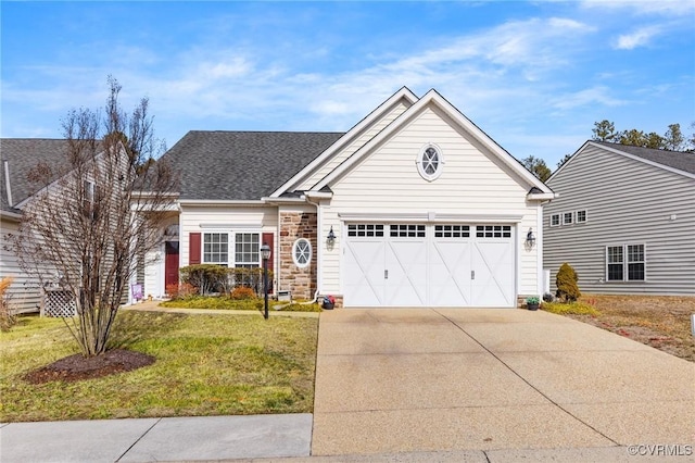 view of front facade featuring a garage and a front lawn