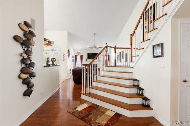 stairway featuring wood-type flooring