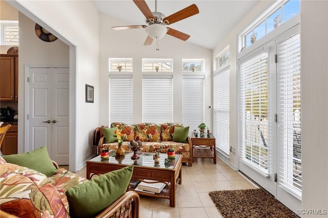 sunroom featuring lofted ceiling, plenty of natural light, and ceiling fan