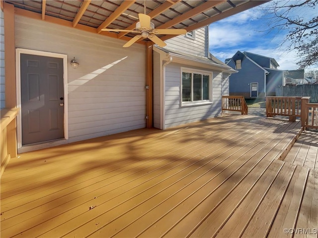 wooden terrace featuring ceiling fan