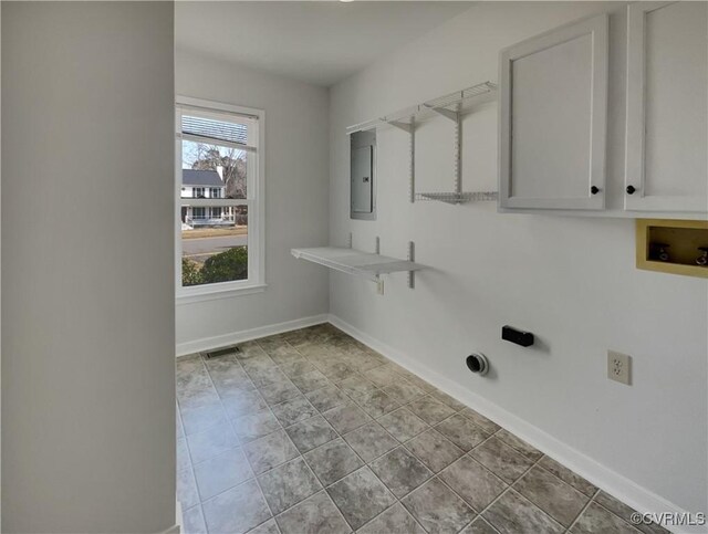 washroom featuring cabinets, washer hookup, and electric panel