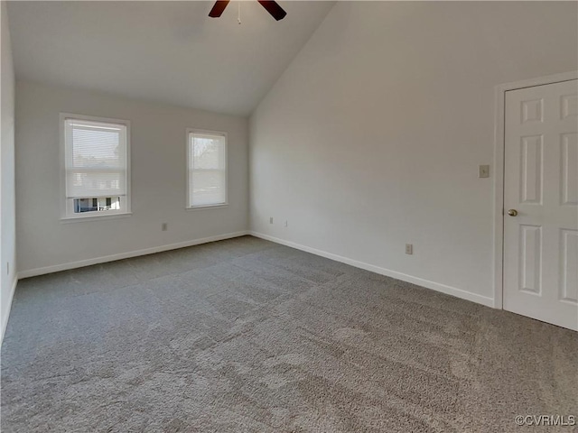 spare room featuring high vaulted ceiling, carpet flooring, and ceiling fan