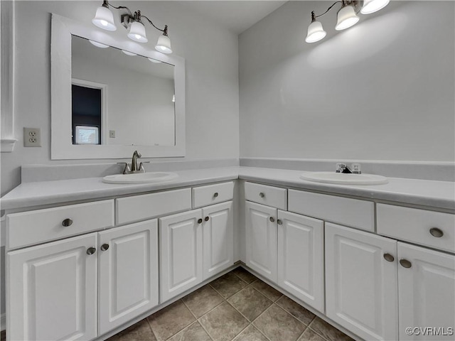 bathroom with tile patterned floors and vanity