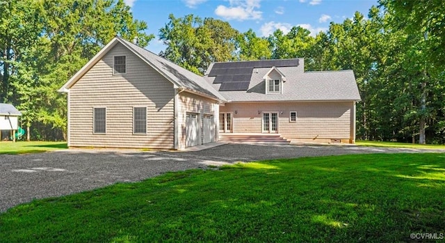 25 Cow Shed Rd, Lancaster, VA 22503 - back of property with french doors, driveway, a yard, and a garage