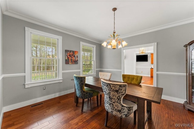 25 Cow Shed Rd, Lancaster, VA 22503 - dining room with a chandelier, ornamental molding, wood finished floors, and baseboards
