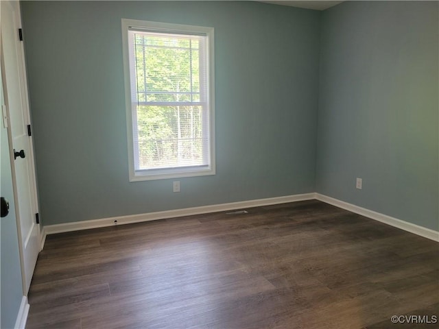 empty room featuring dark hardwood / wood-style floors