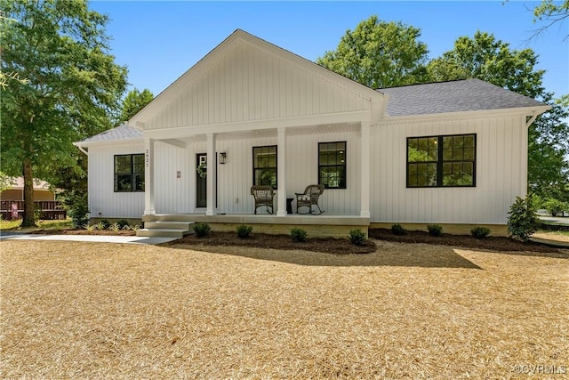 modern farmhouse style home with a porch