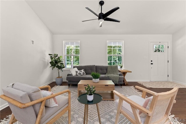 living room featuring hardwood / wood-style flooring, lofted ceiling, and ceiling fan