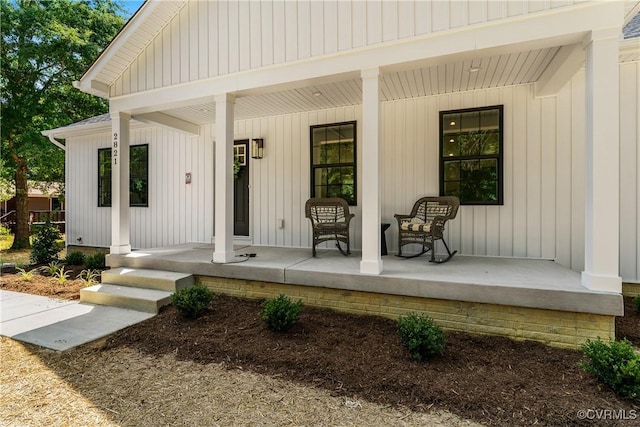 doorway to property featuring a porch