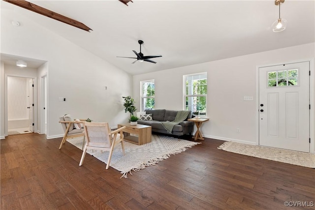 living room featuring dark hardwood / wood-style flooring, high vaulted ceiling, and ceiling fan