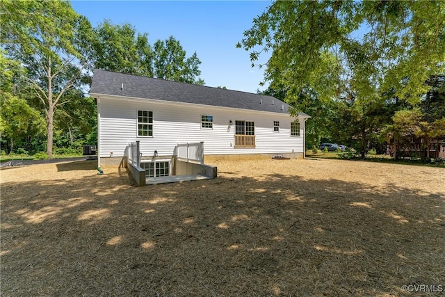 back of house featuring central air condition unit