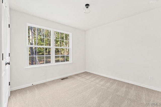 empty room featuring light carpet