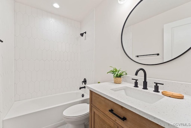 full bathroom featuring vanity, toilet, and tiled shower / bath