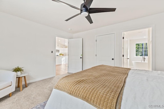 bedroom with ceiling fan and light carpet