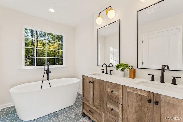 bathroom with vanity and a bath