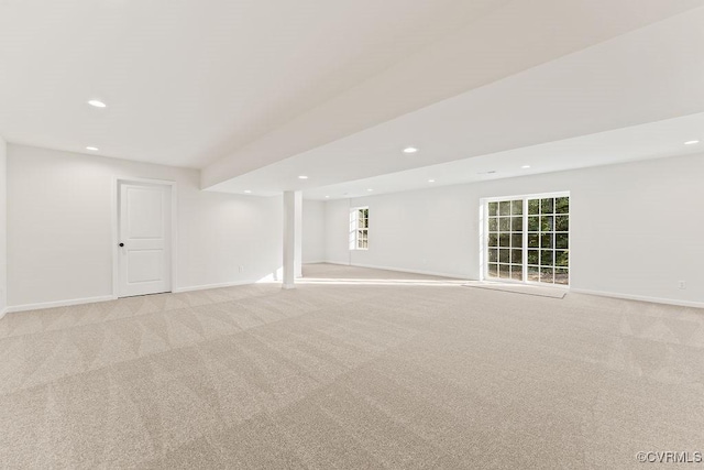 basement featuring light colored carpet