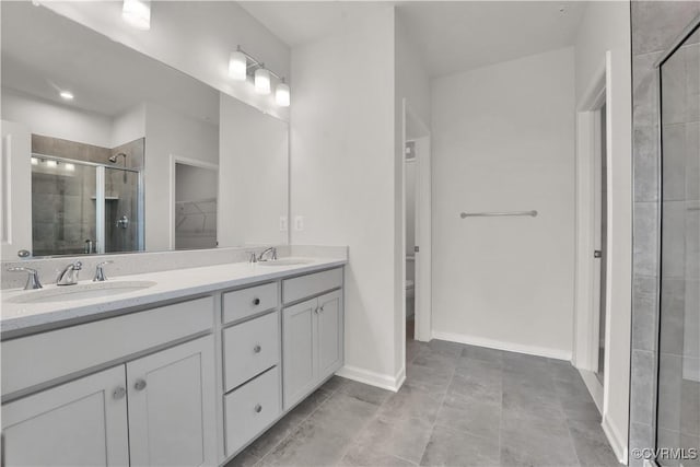 bathroom with walk in shower, vanity, and toilet