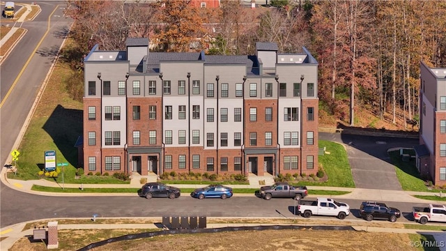 birds eye view of property with a residential view