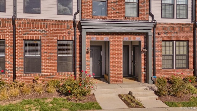 entrance to property with brick siding