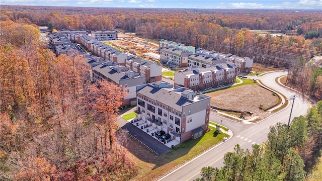 drone / aerial view featuring a view of trees