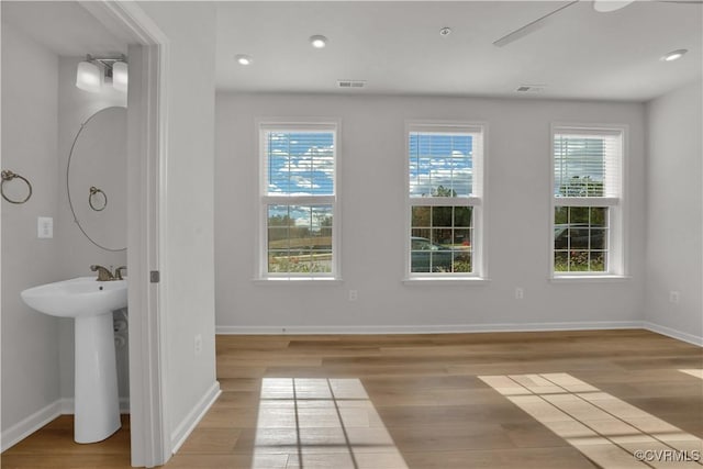 interior space featuring hardwood / wood-style flooring and a wealth of natural light