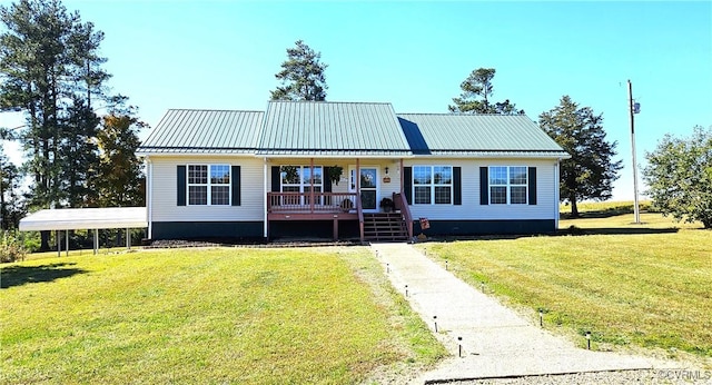 view of front facade with a front lawn and a carport