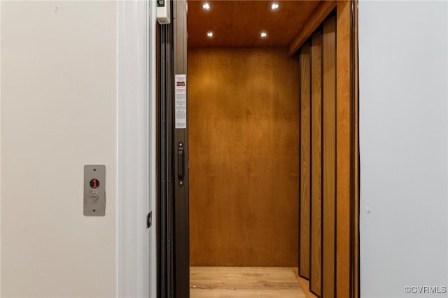 details featuring elevator and recessed lighting