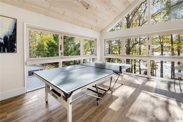 game room with high vaulted ceiling, wooden ceiling, baseboards, and wood finished floors