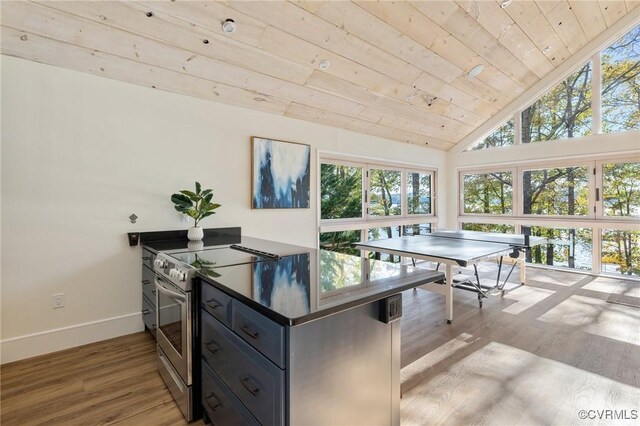 playroom featuring lofted ceiling, light wood-style flooring, wood ceiling, and baseboards