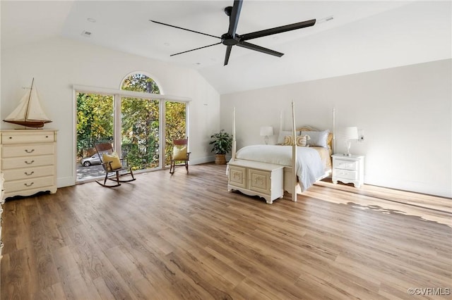 unfurnished bedroom featuring a ceiling fan, lofted ceiling, baseboards, and wood finished floors