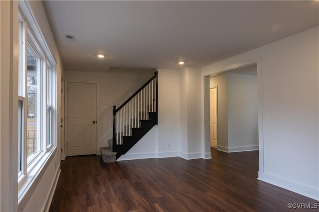 interior space with dark hardwood / wood-style floors