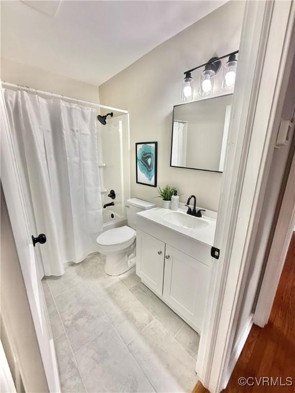 full bathroom featuring vanity, toilet, and shower / tub combo