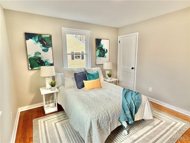 bedroom with wood-type flooring