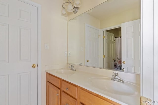 bathroom with double vanity and a sink