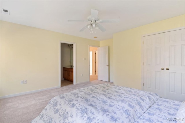 bedroom with ceiling fan, light carpet, visible vents, baseboards, and a closet